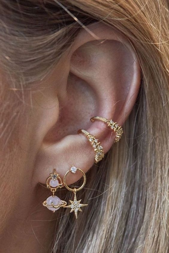 chic and glam ear styling with a double lobe piercing, a double conch piercing done with beautiful and refined gold earrings
