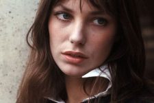 famous Jane Birkin wearing brown shoulder-length hair and wispy bangs with parting that will become her style feature