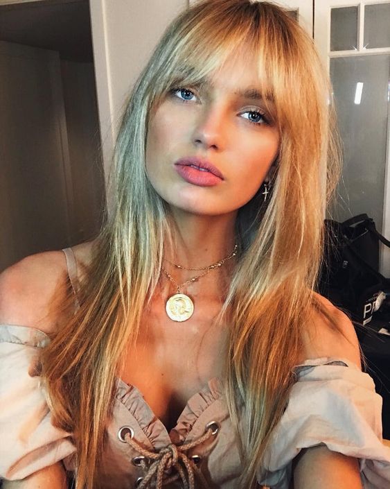 pretty long blonde hair with balayage and a darker root, with effortlessly chic Birkin bangs is a gorgeous idea for trying right now
