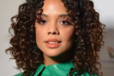the center part is trending, for good reason and, as Tessa Thompson shows us, it can absolutely work for curly hair as well as straight