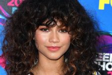 the choppy layers in Zendaya’s long and curly shag cut give it mile-wide volume in every direction