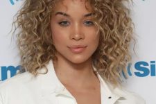 wispy blonde ringlets and lifted roots give Jasmine Sanders a cool, choppy appearance, add some grit to your curls with a texturing spray