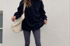 09 a sport chic outfit with a black zip sweatshirt, grey leggings, white socks and trainers, a neutral oversized tote for spring