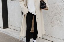 16 a white tee, black leggings, white socks and trainers, a tan trench, a black bag for a sport chic look and maximal comfort
