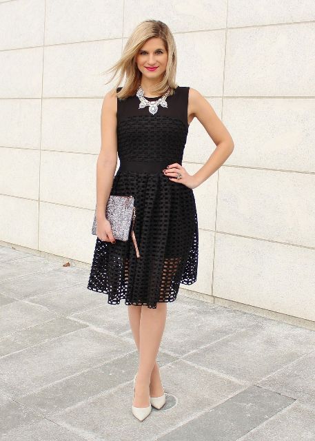 With black lace sleeveless knee-length dress, silver necklace and beige leather pumps