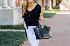 With black long shirt, black leather embellished tote bag, white cuffed jeans and mint green pumps