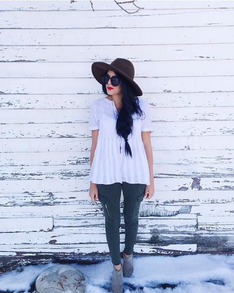 With dark brown wide brim hat, oversized sunglasses, cropped skinny pants and gray suede ankle boots