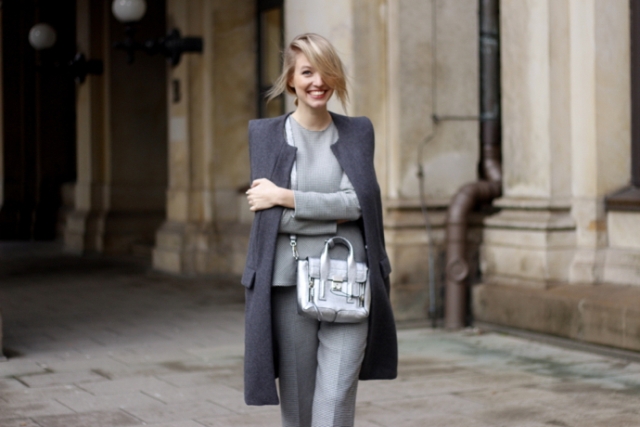 With gray shirt, gray trousers and dark gray collarless knee-length coat