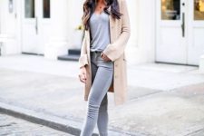 With gray t-shirt, beige long cardigan, sunglasses and beige lace up high heels