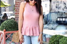 With light blue distressed jeans, straw bag and sunglasses