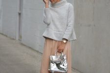 With light gray loose sweatshirt, sunglasses, pale pink pleated knee-length skirt and beige ankle strap high heels