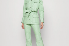With mint green leather belted jacket and white leather heeled boots