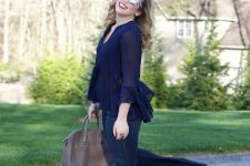 With navy blue ruffled blouse, beige leather bag, navy blue flare jeans and high heels