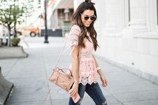 With pale pink lace ruffled blouse, pale pink bag, sunglasses and navy blue distressed skinny jeans