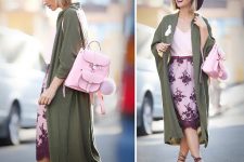 With pale pink top, olive green midi trench coat, lilac and purple lace knee-length skirt, purple wide brim hat and purple lace up high heel sandals