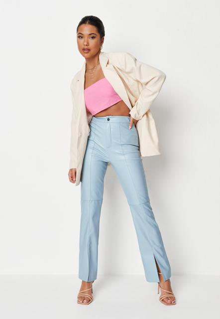 With pink crop top, cream blazer and beige lace up sandals