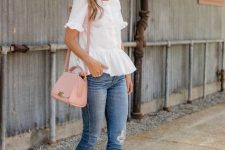 With rounded sunglasses, white ruffled blouse, distressed skinny jeans and pale pink leather bag