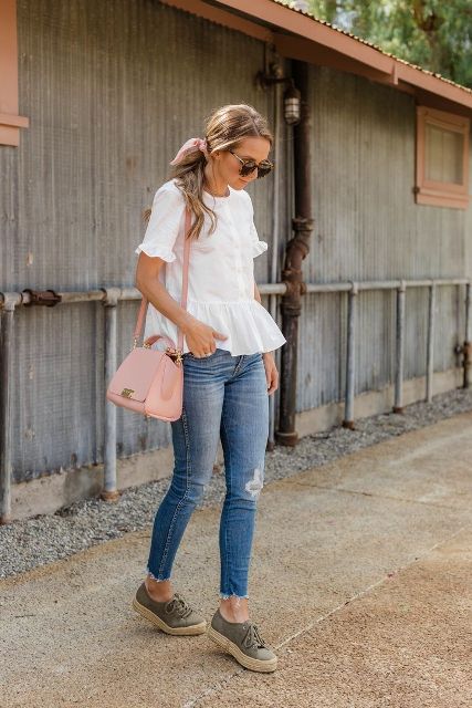 With rounded sunglasses, white ruffled blouse, distressed skinny jeans and pale pink leather bag