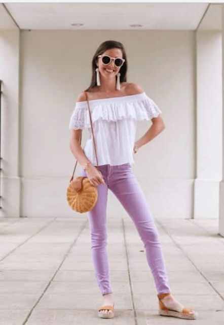 With sunglasses, white earrings, white off the shoulder ruffled shirt, straw rounded bag and brown ankle strap flat sandals