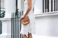 With sunglasses, white lace sleeveless knee-length dress and light brown leather chain strap bag
