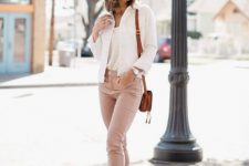 With top, white jacket, brown leather bag and white and brown platform sandals