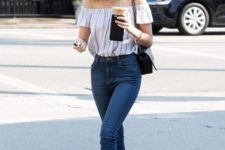 With white and gray striped off the shoulder top, black chain strap bag, skinny jeans and white flat shoes