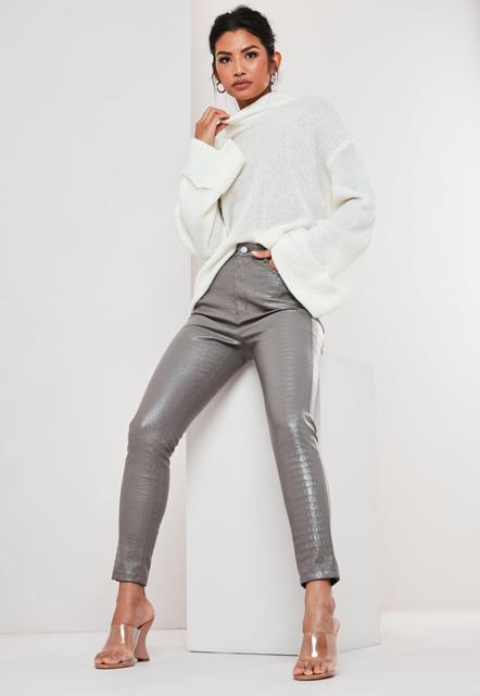 With white bell sleeved loose sweater and transparent high heel mules