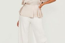 With white palazzo pants and white sandals
