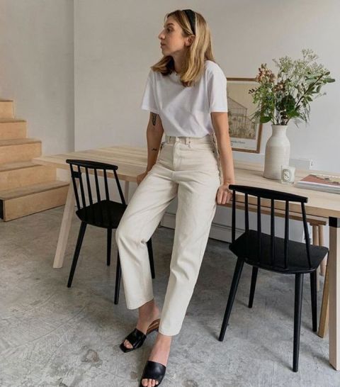 With white t-shirt and black leather low heeled mules