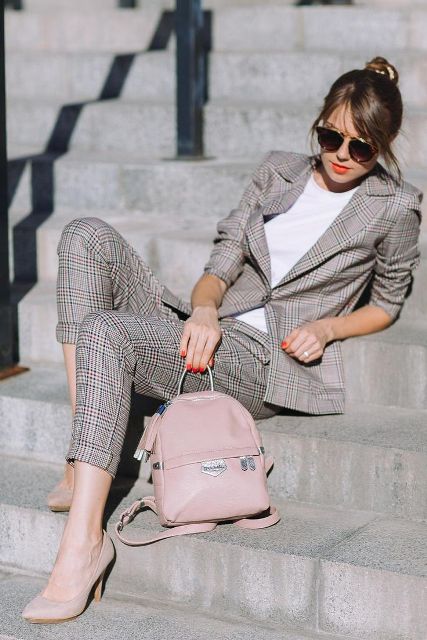 With white t shirt, oversized sunglasses, checked blazer, checked cuffed trousers and beige pumps