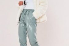 With white turtleneck, cream faux fur jacket and white sneakers