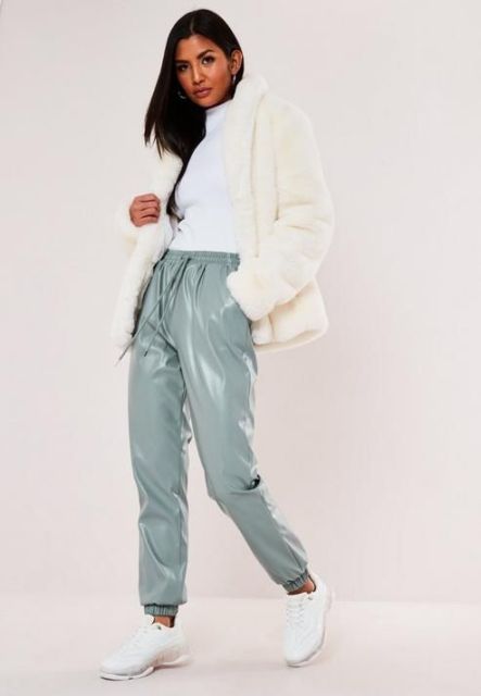 With white turtleneck, cream faux fur jacket and white sneakers
