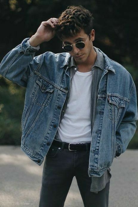 a 90s outfit with a white t-shirt, a chambray shirt, a blue denim jacket and graphite grey jeans