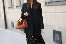a black and gold polka dot midi dress, a black oversized blazer, black suede booties and a brown bag for a chic outfit