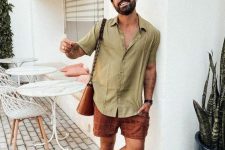 a comfortable summer outfit with a beige linen shirt, red checked shorts, black sandals, a brown bag is cool and easy to repeat