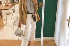 a grey t-shirt, an oversized beige blazer, white culottes, brown shoes and a small grey bag for a simple work look