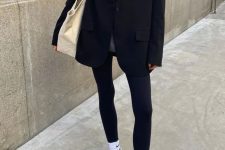 a grey turtleneck, an oversized black blazer, black leggings, white socks, grey trainers and a creamy tote