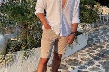 a hot summer day look with a white linen button down, tan denim shorts, beige sandals will keep you comfortable