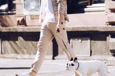 a monochromatic and cozy outfit with a white tee, a tan checked shirt, tan joggers, white sneakers is ideal for every day