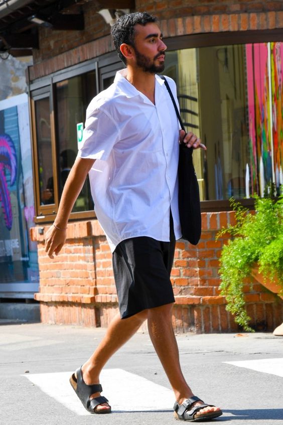 a monochromatic summer look with an oversized white shirt, black shorts, black birkenstocks and a black tote