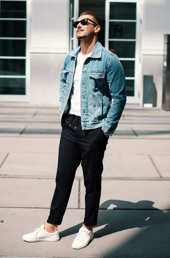 a relaxed summer look with a white t-shirt, a light blue denim jacket, black pants and white sneakers