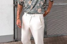 a summer outfit with a grey floral print short-sleeved shirt, white pants, white trainers and a necklace is easy and comfy