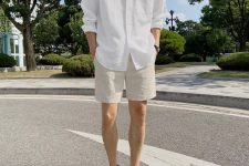 a timeless casual summer look with a white button down, tan shorts and white sneakers is ideal for many occasions