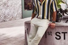 a vacation look with a vertical stripe short-sleeved shirt, neutral linen pants, grey birkenstocks is easy and comfortable