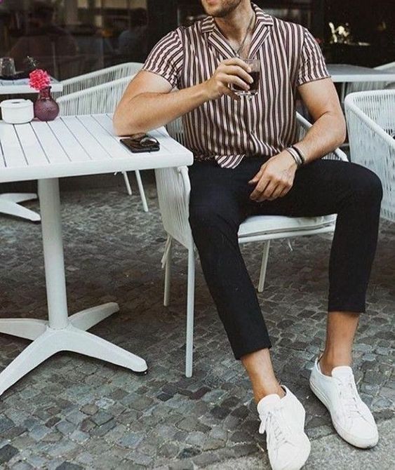 a vertical stripe short sleeved shirt, black cropped jeans, white sneakers for a stylish and simple spring look