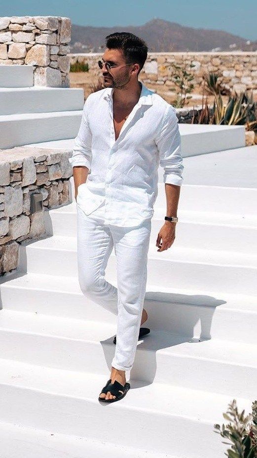 a very simple summer outfit suitable for work with a white linen button down and pants plus black slippers