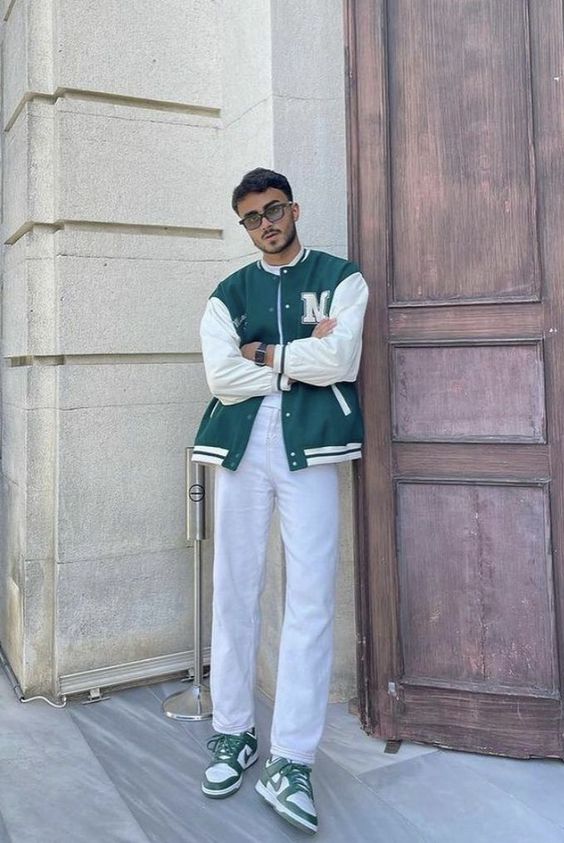 a white t-shirt, white jeans, a green bomber jacket and green trainers for a back to school inspired look