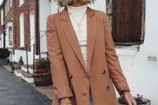 a white turtleneck, wideleg pants, a camel blazer, a brown bag and layered necklaces for work in spring