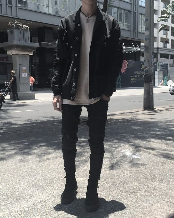 an edgy fall look with a white t-shirt, a black denim jacket, black skinnies and black boots