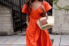 04 a bold orange midi dress with a deep neckline, wide sleeves and a sash will make a statement, neutral shoes and a straw bag are great additions here